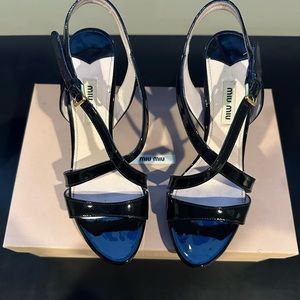 Miu Miu black patent strapped sandal. Very good condition.